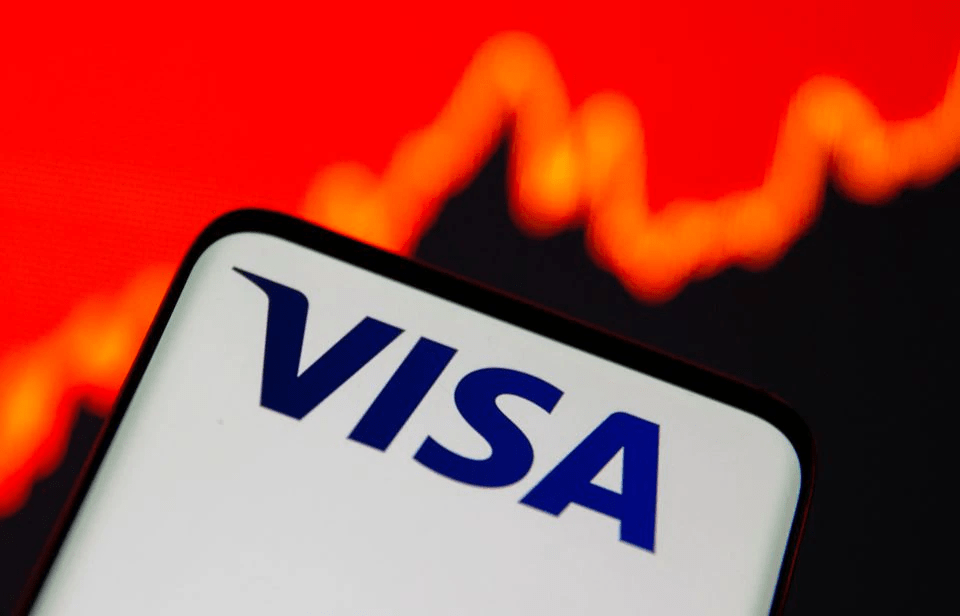 Smartphone with Visa logo is seen in front of displayed stock graph in this illustration taken, July 15, 2021. REUTERS/Dado Ruvic/Illustration