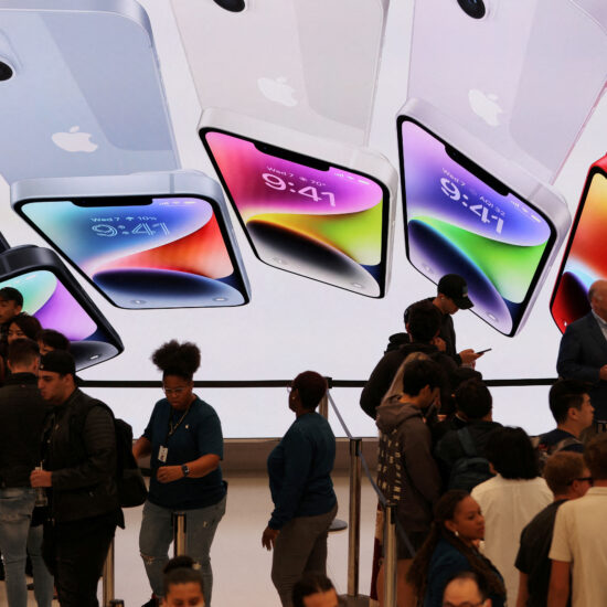 Apple iPhone sales inch up, bolstering results amid shaky economy