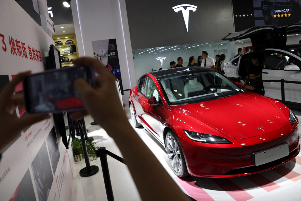 Tesla warns of slowing growth before new model launch next year