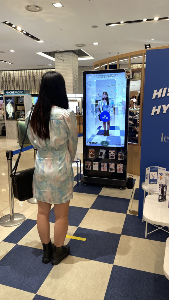 Sunny Um from 4i Mag tests AI perfumer Hyscent kiosk at Hyundai Department Store, Seoul, South Korea on 11 October, 2024.